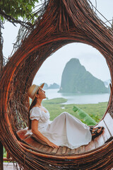 Summer vacation concept, asian female traveler enjoying vacation in beautiful view cafe at Phangnga ,Thailand
