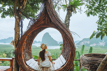 Summer vacation concept, asian female traveler enjoying vacation in beautiful view cafe at Phangnga ,Thailand