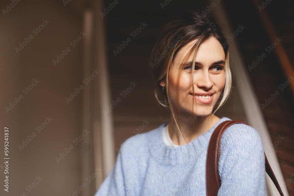 Wall mural portrait of happy smiling blonde woman exit her home she go away with bag on shoulder. blonde happy 