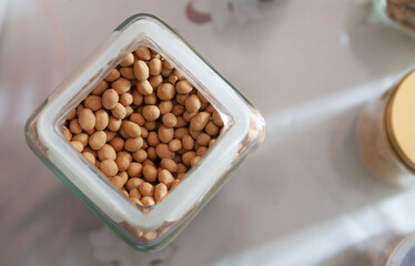 top view of floured fried peanuts in a jar