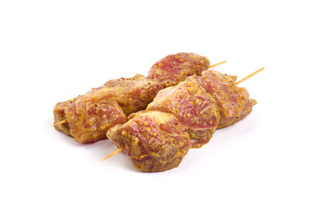 Raw pork skewers, ready to cook, kebab BBQ, isolated on white background.