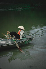 boat rider in vietnam