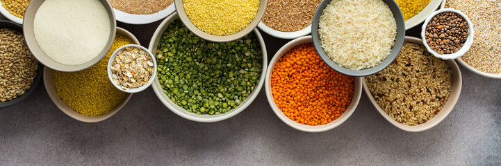 Various grain cereals in bowls banner, top view