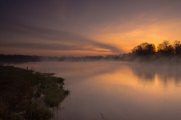 Fototapeta na wymiar Sunrise over the ponds in Lesser Poland
