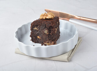 premium freshly baked dark cocoa chocolate brownie square cake with walnut in wood bento box on white marble halal food sweet dessert menu for pastry cafe shop