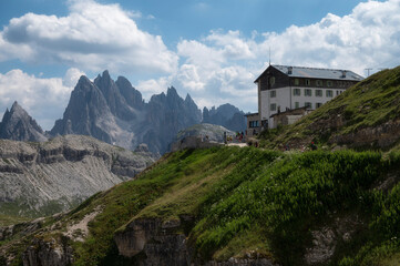 Fototapeta na wymiar Mountain hut and Cadini di Misurina peak in Dolomite, Italy in Summer