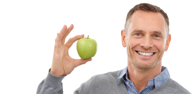 Smile, apple or portrait of happy man with fruit for wellness isolated on transparent png background. Nutrition vitamins, detox or mature male person eating healthy food or clean diet to lose weight