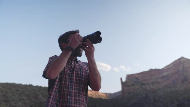 Photographer taking pictures of the beautiful landscape in Southwest of USA on a sunny day