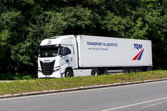 White Iveco S-Way semi-trailer truck of Czech TQM transportation company waiting