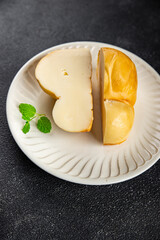 fresh cheese scamorza smoked flavor food snack on the table copy space food background rustic top view