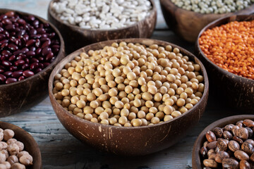 close up dried legumes soy beans in wooden bowl