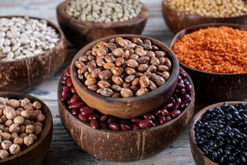 close up dried legumes tiger beans in wooden bowl