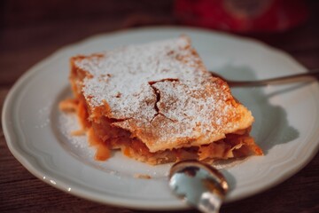 Delicious freshly-baked apple strudel sprinkled with a light dusting of powdered sugar
