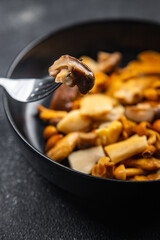 appetizer mushroom salad mix white mushroom, boletus mushroom, chanterelle mushroom, ready to eat meal food snack on the table copy space food background rustic top view