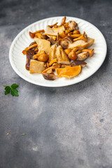 appetizer mushroom salad mix white mushroom, boletus mushroom, chanterelle mushroom, ready to eat meal food snack on the table copy space food background rustic top view