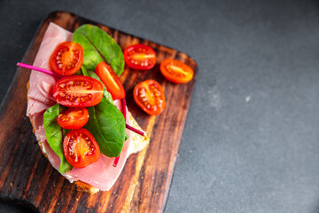 bruschetta tomato sandwich ham, lettuce snack meal food snack on the table copy space food background rustic top view