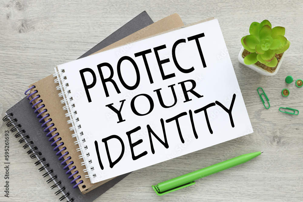 Poster protect your identity there are three notebooks on the work table near a plant in a pot with text