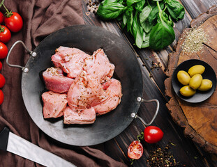Raw pork meat heap for roast on pan