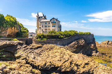 Villa Belza on a sunny day in Biarritz, France at low tide