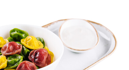 Colorful dumplings in a white plate