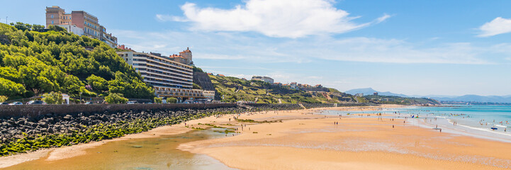 Coastline and sandy beach of the Cote des Basques in Biarritz, France on a summer day - obrazy, fototapety, plakaty