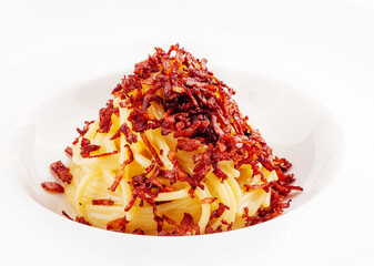 Portion of spaghetti with fried bacon
