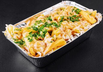 delicious french fries with cheese sauce