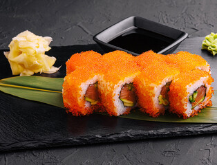 Sushi rolls philadelphia on a black slate