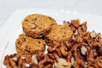Healthy breakfast oat granola with nuts on a plate.