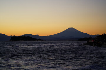 Naklejka na ściany i meble Mt. Fuji and Enoshima island from Inamuragasaki at the evening