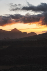 Landscape with mountains in the background and a cloudy evening day