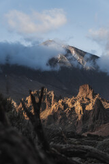Landscape with mountains in the background and a cloudy evening day