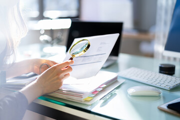 Lawyer Examining Paper Using Magnifier Glass