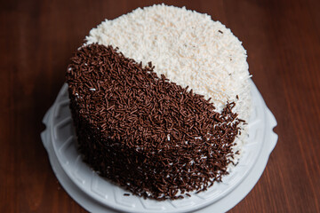 Biscuit baked cake with boiled condensed milk and chocolate. Pastry.