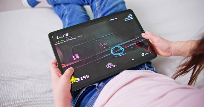 Kid Playing Game On Tablet Computer
