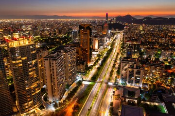 Aerial view of Kennedy Avenue in the city of Santiago de Chile at sunset.