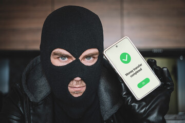 Mobile banking hack cyber security concept. Hacker and criminal login to persons online bank...