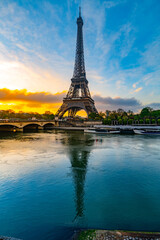 Eiffel Tower, French: Tour Eiffel, silhouette at sunrise time on sunny day. View from Seine River. Paris, France