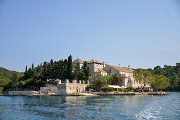 Majestic Benedictine monastery at Mljet park, stands atop a verdant hillside