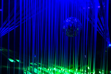Green and blue laser beams on black background. Laser show rays stream