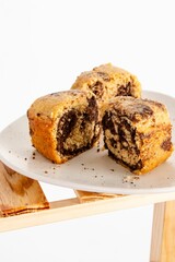 Pieces of freshly baked biscuit cake on a white plate