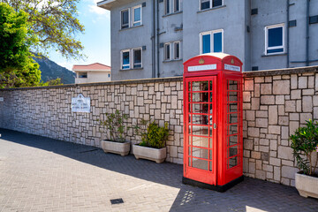 Iconic british old red telephone box at the entrance in Gibraltar