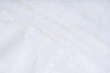 Obraz premium The white background with lace flower. Texture background pattern.