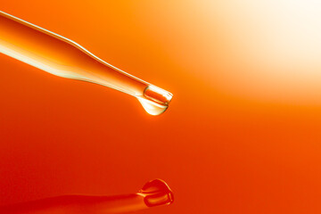 Macro science experiment pipette surface,Top view macro shot of chemical dropper injects oil into...