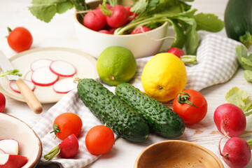 Radish and other spring vegetables on a wooden background, close-up.