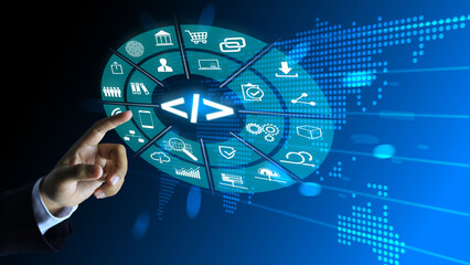 Software developers reach out to touch the programming code which is important in marketing analytics.