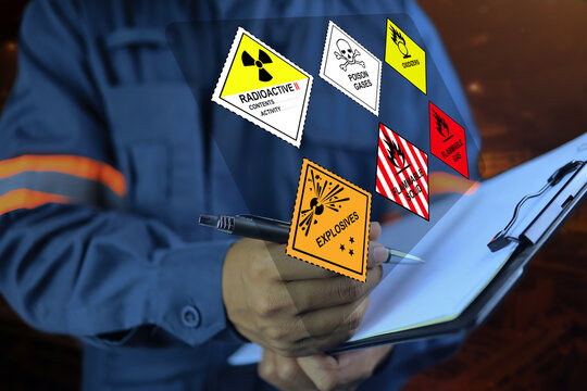 Security officers hold clipboards and inspect the storage of dangerous goods in the warehouse for operator safety such as explosions, radioactive, toxic gases, etc.