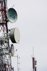 Antennae on white background of cloudy sky and space for text.