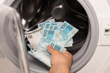 Brazilian money in the washing machine, Concept, Money laundering, Illegal business, Black market...
