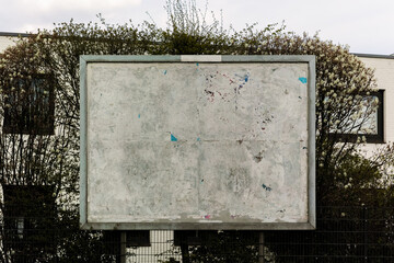 old billboard with torn paper surface, torn grunge poster textured background, carded blank...